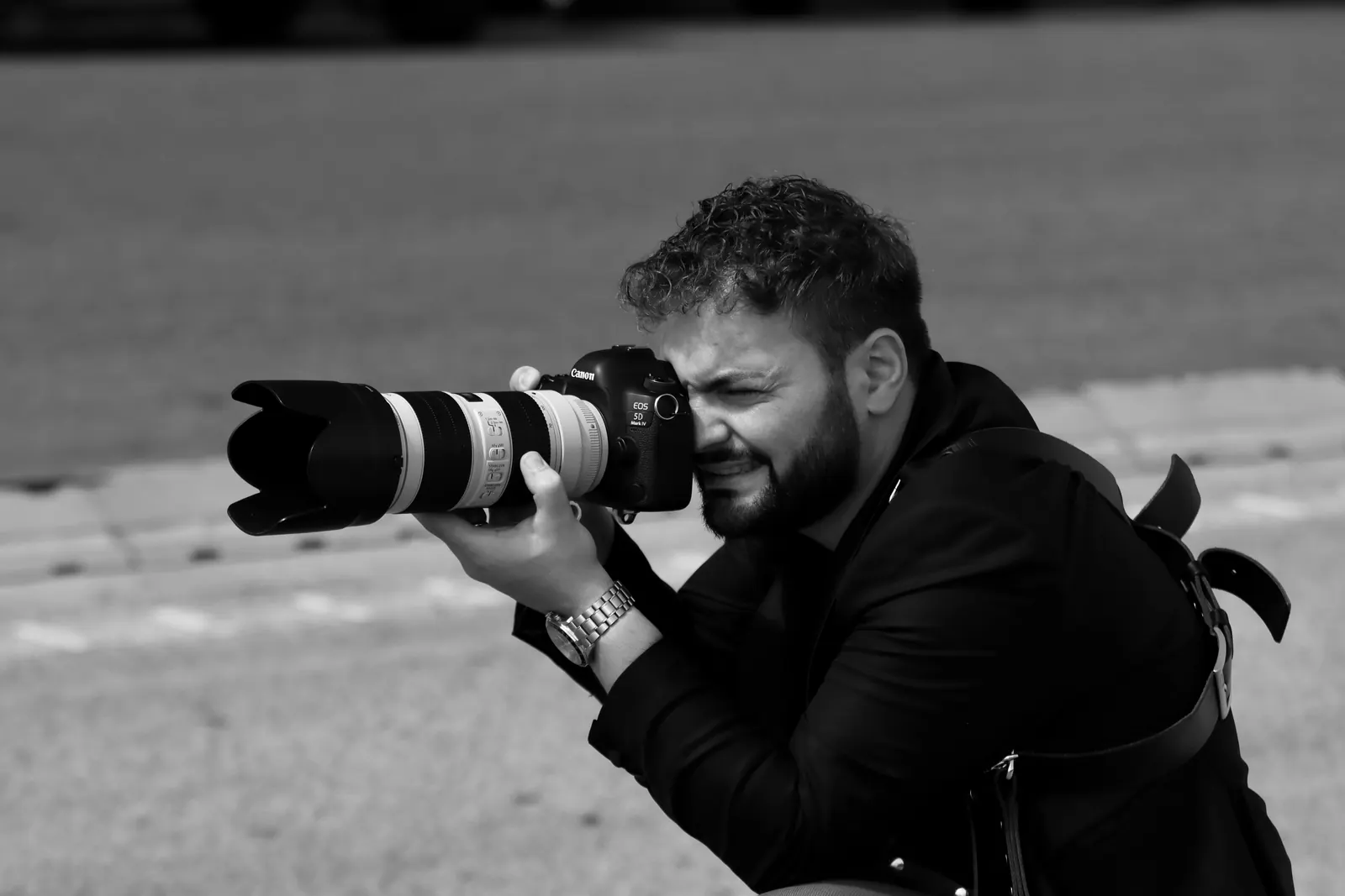 Professional photographer taking photos with a DSLR camera