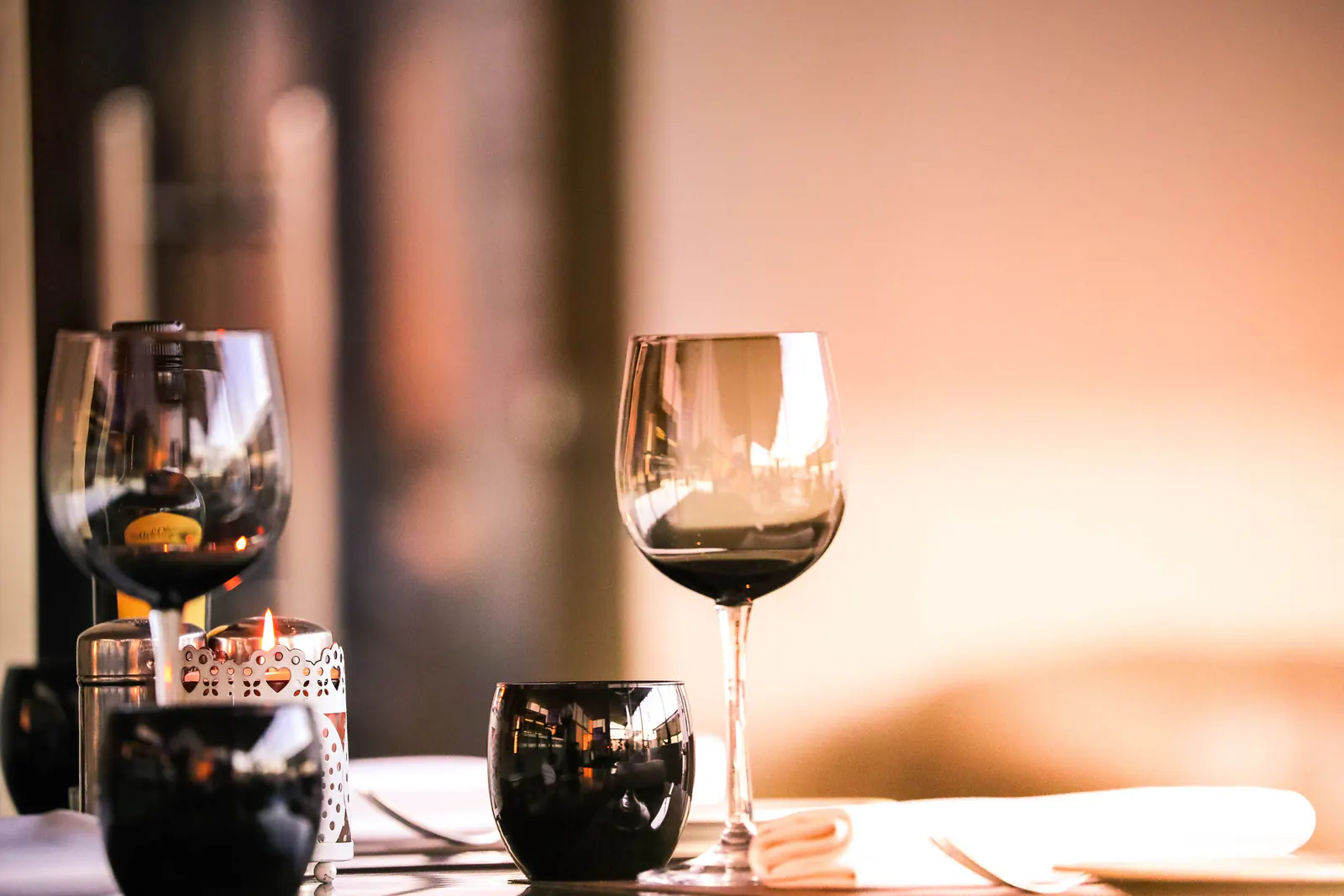 Restaurant table set with wine glasses for dinner