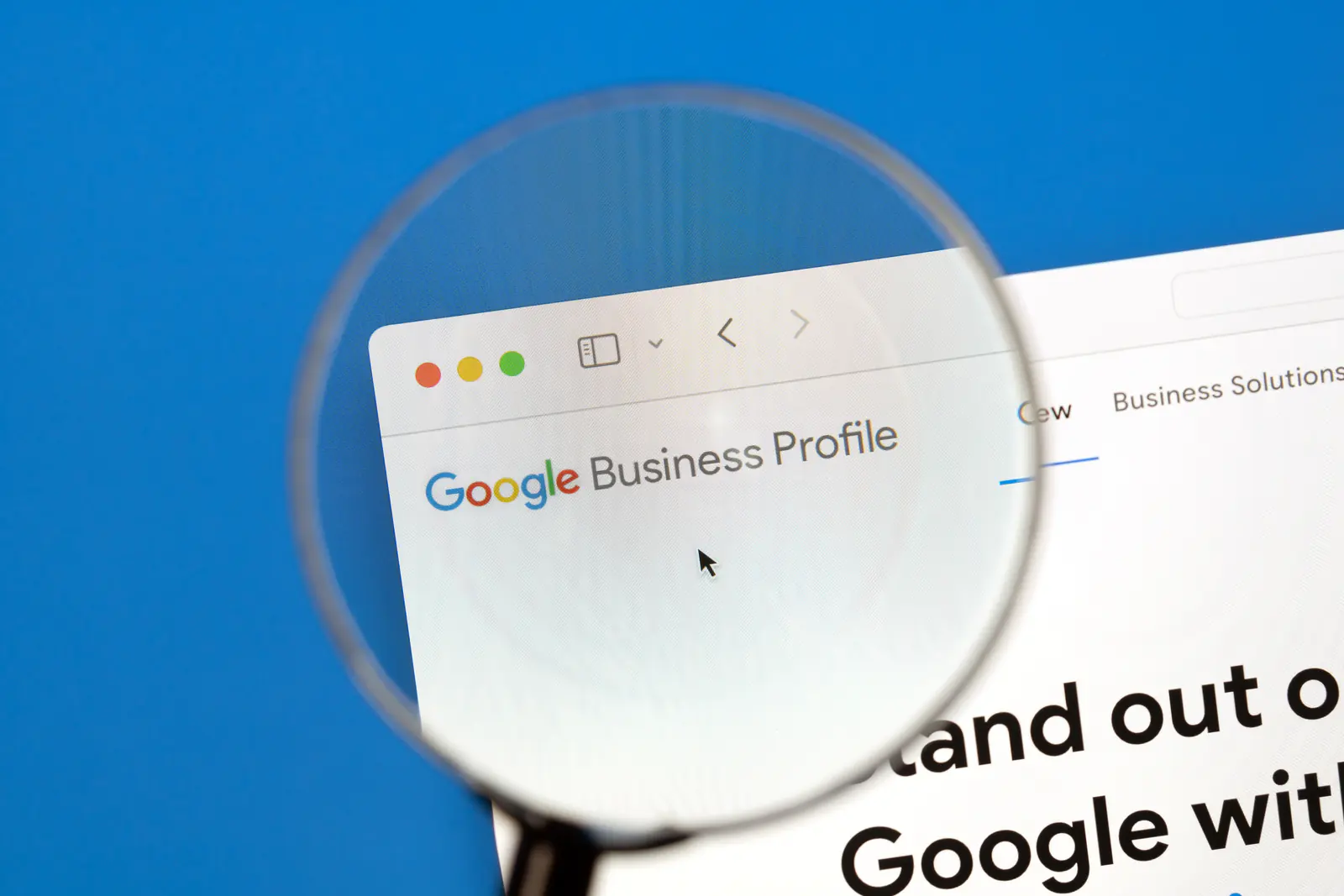 Google Business Profile listing viewed through a magnifying glass